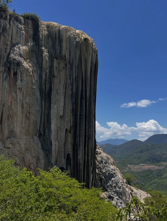 Morning light on the Hierve el Agua terraces with the Sierra behind
